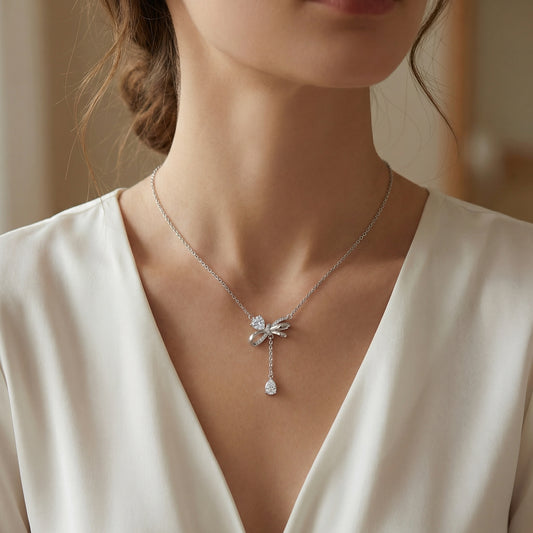 925 Sterling Silver Elegant Silver Bow Necklace Featuring Sparkling Heart and Pear-Cut Zirconia Accents