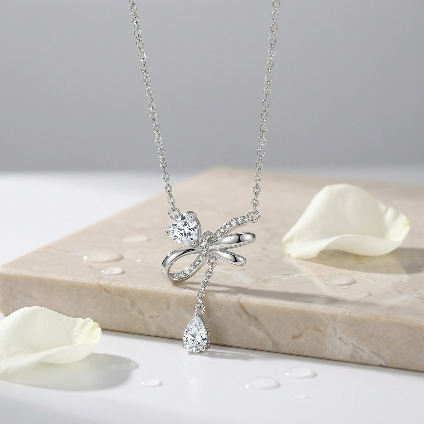 925 Sterling Silver Elegant Silver Bow Necklace Featuring Sparkling Heart and Pear-Cut Zirconia Accents