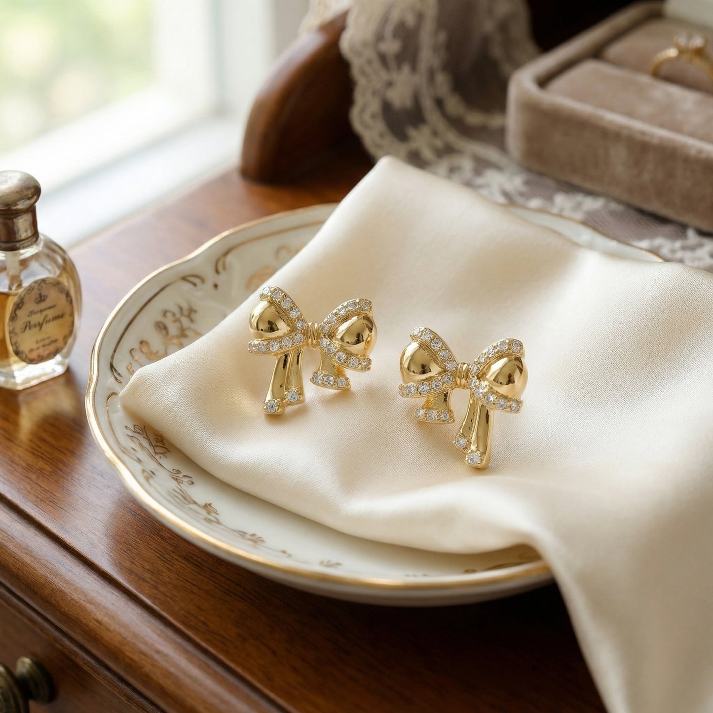 925 Sterling Silver Shimmering Ribbon Bow Stud Earrings with Radiant Clear Stone Embellishments